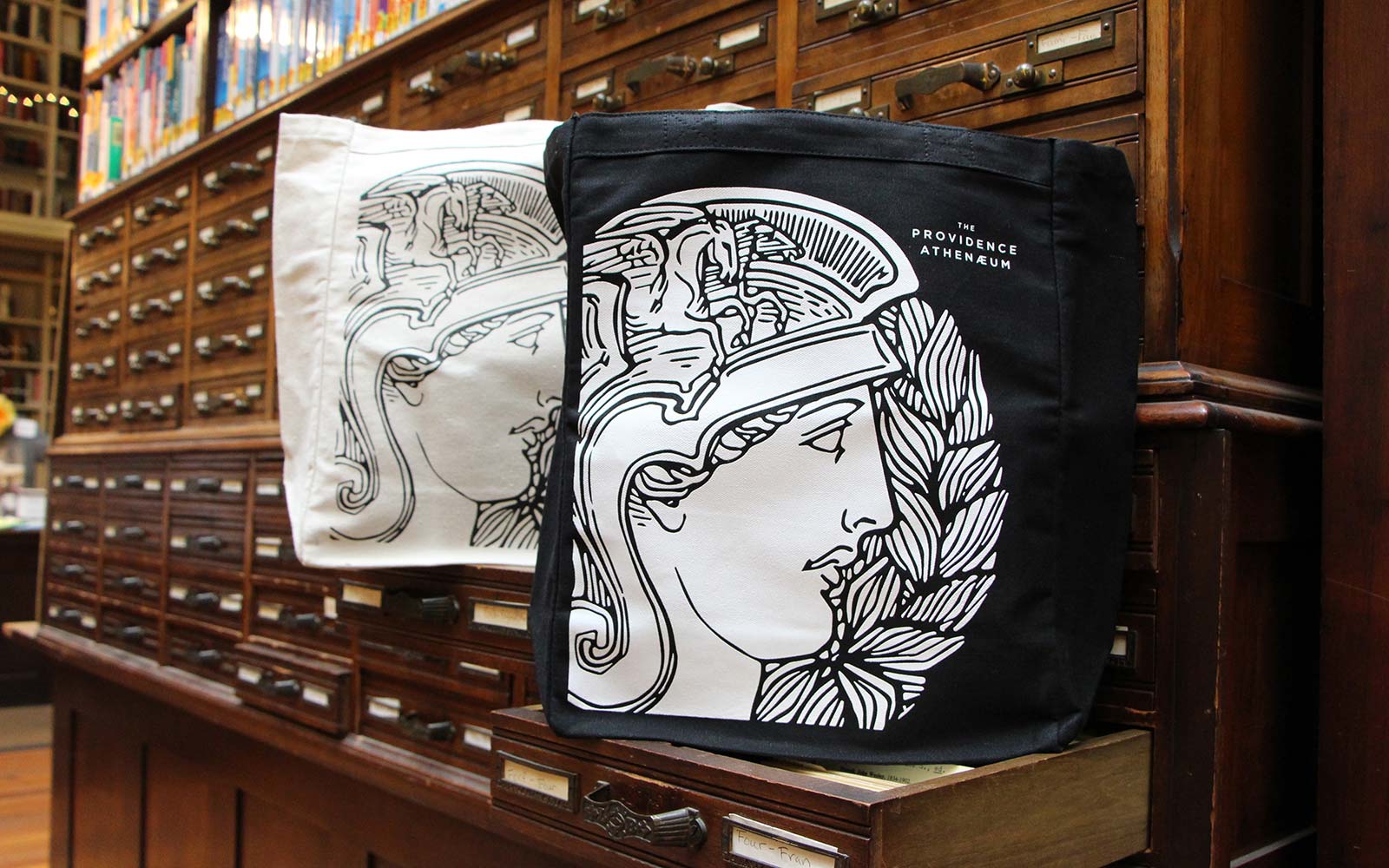 Photo of tote bags designed for the Providence Athenaeum